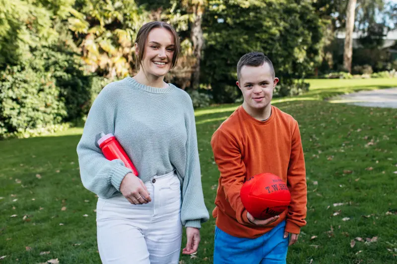 Disability worker Tanae with Darcy a 17-year-old living with Down Syndrome